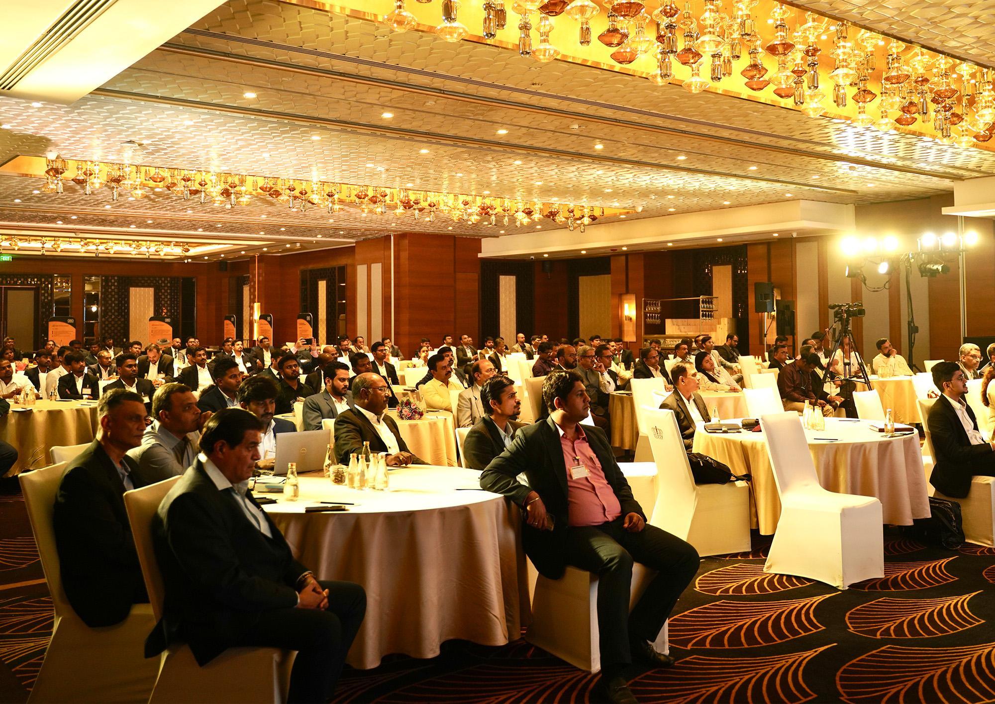 Professionals attending a large conference program